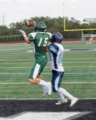 Fototapeta premium Great action photos of high school football players making amazing plays during a football game