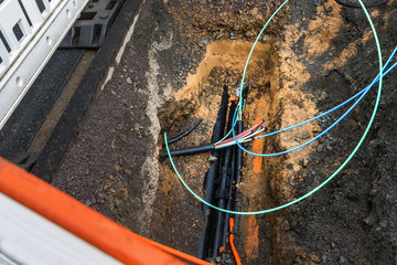 Fototapeta na wymiar optical fiber cables laying construction site