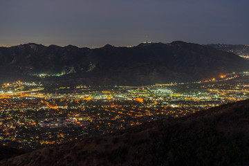 Night mountaintop view of Glendale and Griffith Park in Los Angeles, California.