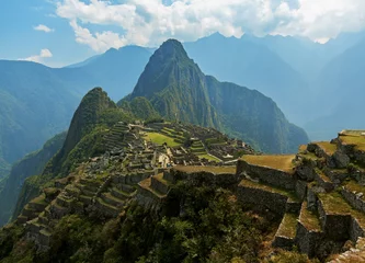 Photo sur Plexiglas Machu Picchu Machu Picchu, Cusco region, Peru: Overview of agriculture terraces, Wayna Picchu and surrounding mountains in the background, UNESCO, World Heritage Site. One of the New Seven Wonders of the World