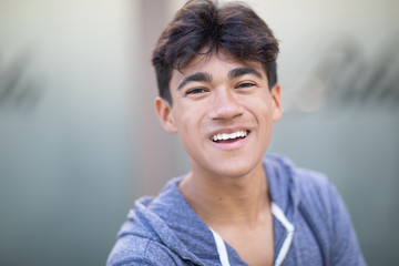 Portrait of a handsome Asian young man next to the blurred background