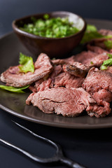 plate with sliced roast beef