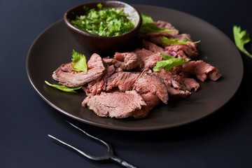 plate with sliced roast beef