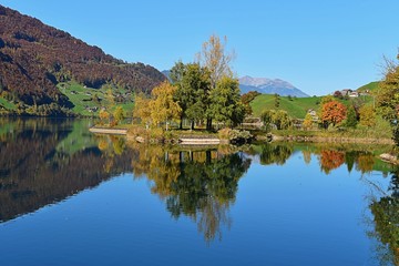 swiss lake at the village lungern, in autumn 