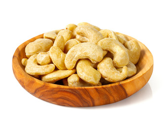 cashew nuts in a bowl isolated on white background