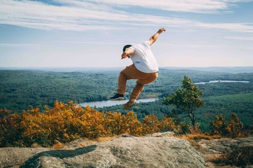 Guy Jumping On Mountain
