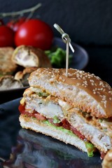 Brain Burger. Fried brains beef, calf or sheep are fried in deep fried as a cutlet in a burger. shows a sandwich in a section. fashionable exotic food. Zombie food.