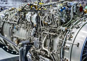 Engine of fighter jet, internal structure with hydraulic. Fuel pipes and other hardware equipment of army aviation and aerospace industry © maxoidos