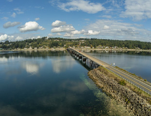 Fototapeta na wymiar Outstanding aerial photography of the picturesque Fox Island Bridge connection Gig Harbor and Fox Island in the state of Washington.
