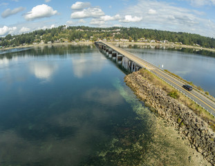 Fototapeta na wymiar Outstanding aerial photography of the picturesque Fox Island Bridge connection Gig Harbor and Fox Island in the state of Washington.