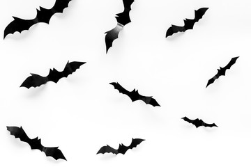 Halloween background with bats on white table top view