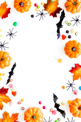 Obraz premium Halloween composition with sweets on white background top view frame space for text