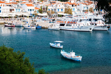 Fototapeta na wymiar boats in a bay in the scenic island Skiathos