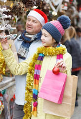 Girl choosing Xmas decoration