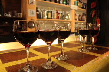 Cups of wine at a bar counter