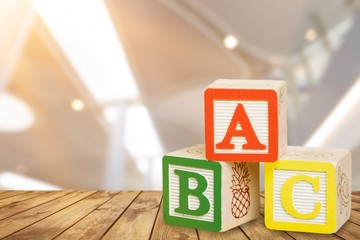 Wooden colored cubes with letters on the table