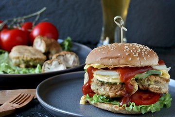 Brain Burger. Fried brains beef, calf or sheep are fried in deep fried as a cutlet in a burger. shows a sandwich in a section. fashionable exotic food. Zombie food. weird food. hipster food