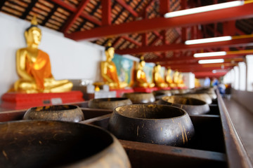 Buddha images and Bowls of Merit in Wat Phra Mahathat Woramahawihan.
