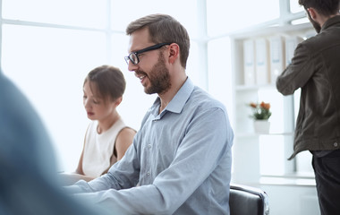 close up. colleagues discussing online information in the workplace