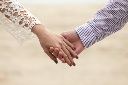 Romantic couple on the beaches of Santa Catarina, Brazil. The South of Brazil has beautiful landscapes for photos Pre-weddings and Trash The Dress with the bride and groom