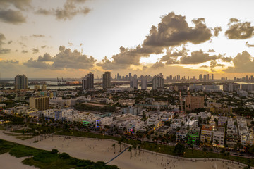 Fototapeta premium Tourism Miami Beach Ocean Drive aerial drone photo with moody sky