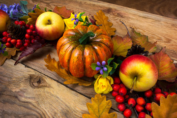 Fall wreath with pumpkin, purple flowers, apples