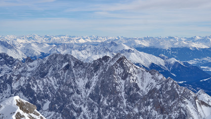 Panoramic view, Alpine mountains from the top of the Zugspitze peak, Germany.  It lies south of the town of Garmisch-Partenkirchen.