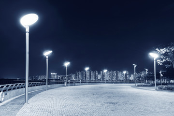 Seaside Promenade of Harbor in Hong Kong city at night