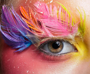 Woman with fashion feather eyelashes make-up