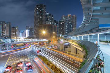 Traffic and skyline of downtown of Hong Kong city at night