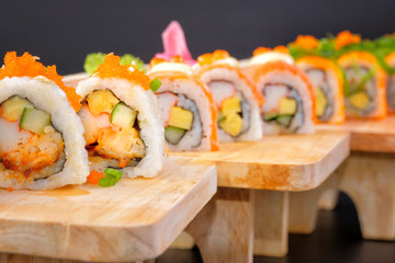 Japanese Cuisine - Sushi Roll on wood plate in white background