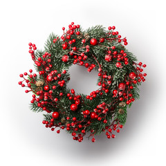 green christmas wreath with decorations isolated on white background