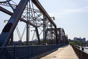 bridge open to walking and cycling pedestrian friendly wooden vintage brige in Ottawa Canada