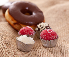 Assorted candy and a chocolate donut