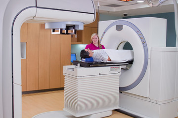 Hispanic Man Receiving Medical Scan / Treatment for Prostate Cancer