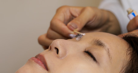 Microblading procedure, master work on woman eyebrow
