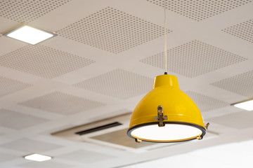 Yellow lamp on ceiling