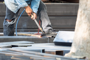 worker working with iron welding machine