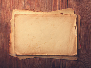 Stack old papers on a wooden table