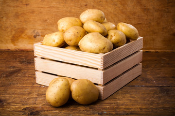 Potatoes in a wooden box
