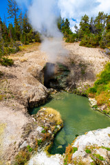 Naklejka na ściany i meble Steam Emits From Dragon's Mouth Spring Cave at Yellowstone National Park