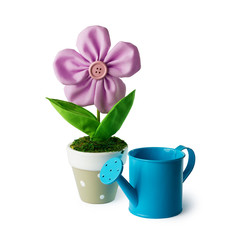 Watering can and flower.