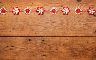 Snowflakes on grunge wooden background