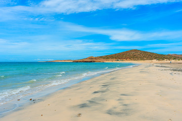 Beautiful beach with blue sea and sky the desert mountain at Baja California, Mexico