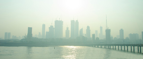 Fototapeta premium Mumbai city with a lot of dust. Just see silhouette of big building.