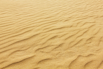 closeup of sand pattern of a beach