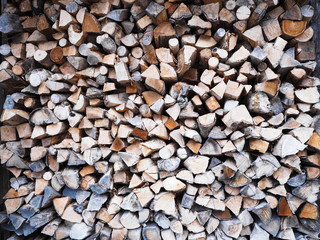 Natural organic stacked wooden cut logs