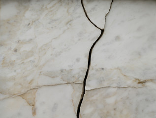 The wall is white marble with cracks.Marble slab.
