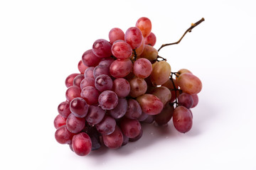Bunch ripe red grape isolated on white background.