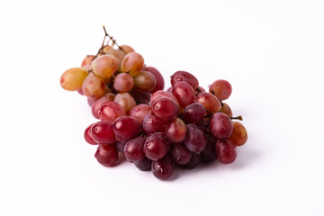 Bunch ripe red grape isolated on white background.